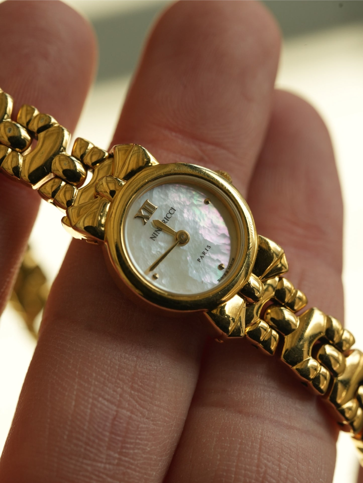 Nina Ricci Ribbon Motif Bracelet Watch – Gold Tone Mother of Pearl Dial – With Original Box & Extra Leather Straps Set