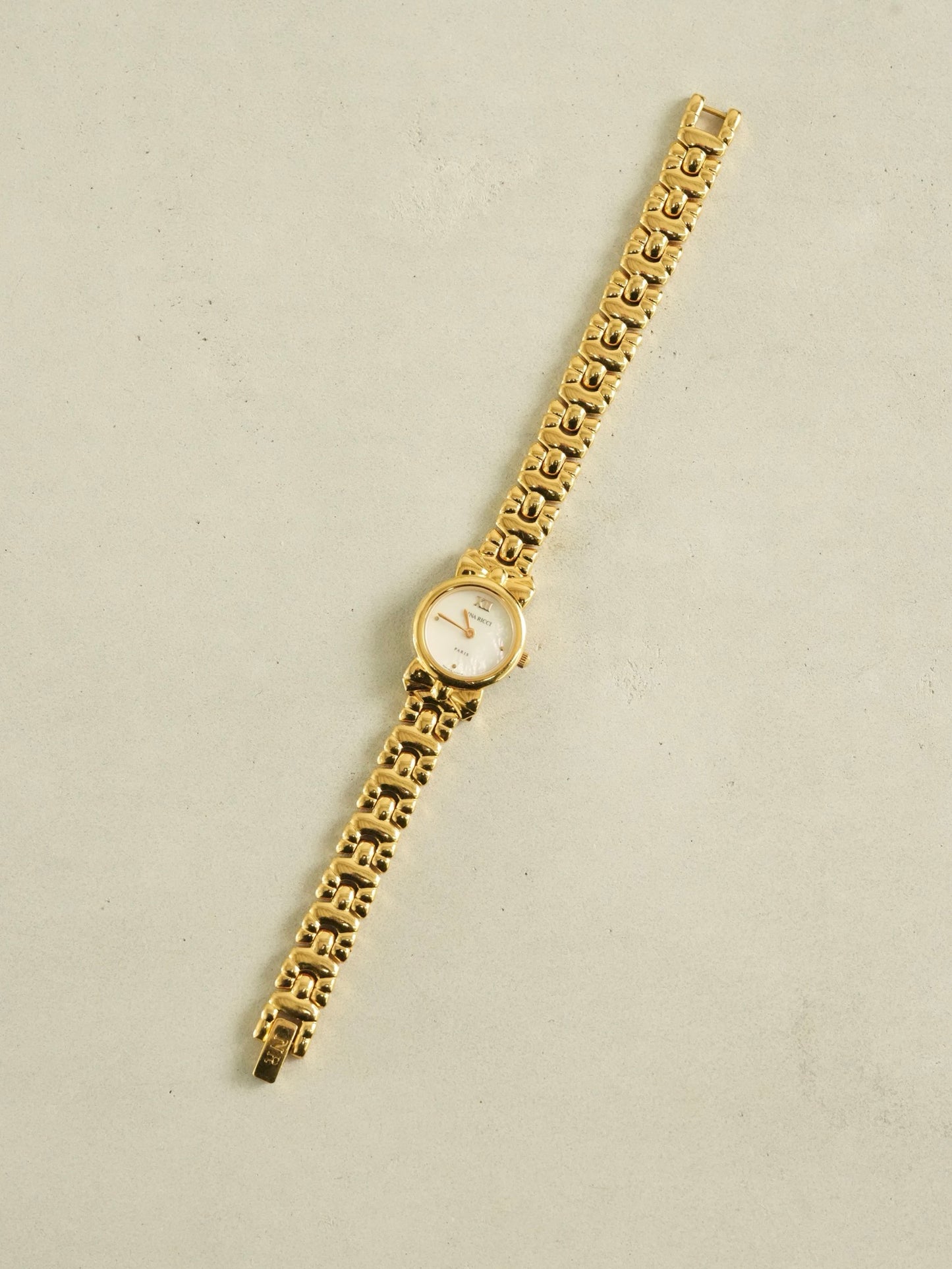 Nina Ricci Ribbon Motif Bracelet Watch – Gold Tone Mother of Pearl Dial – With Original Box & Extra Leather Straps Set