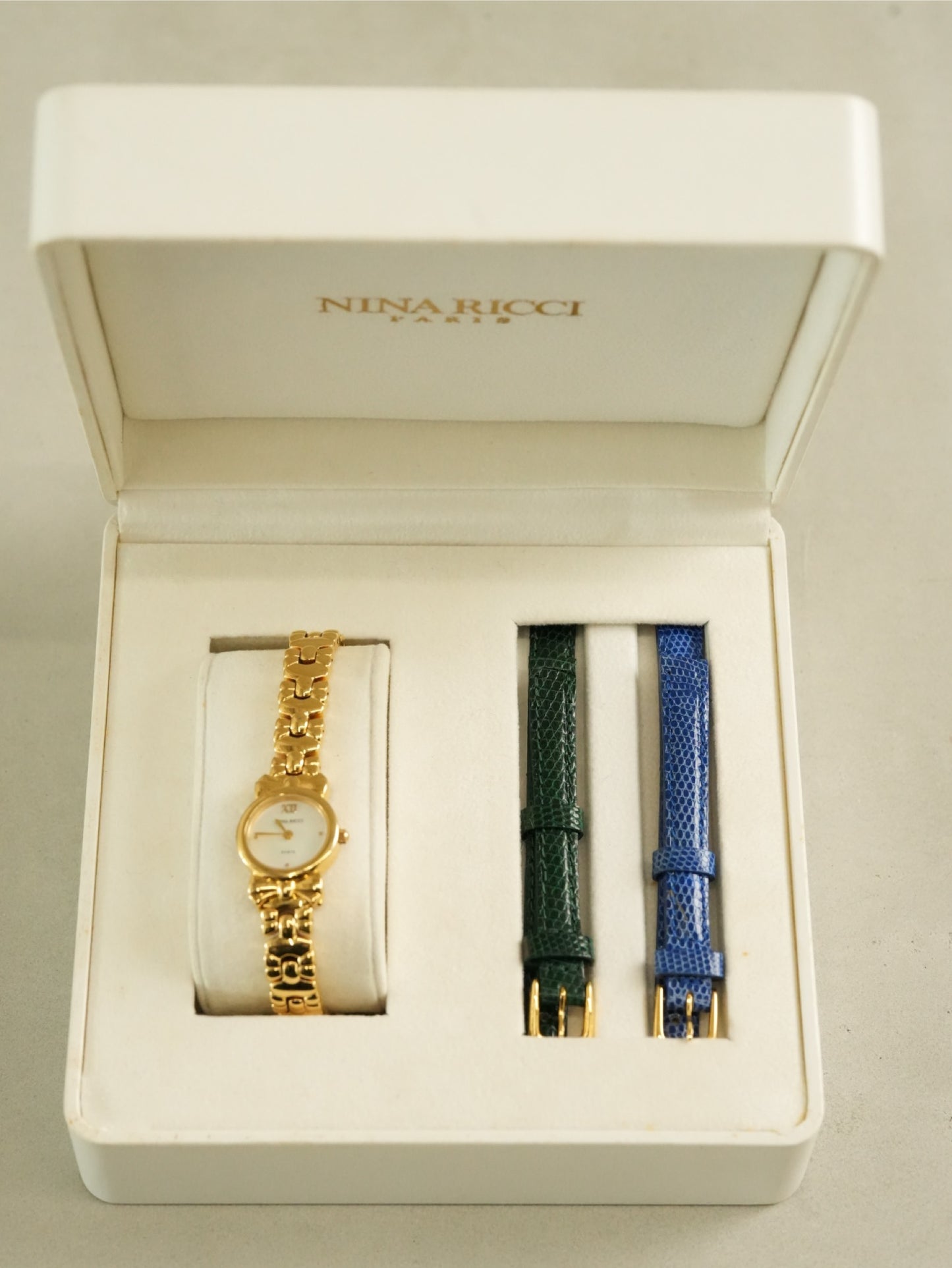 Nina Ricci Ribbon Motif Bracelet Watch – Gold Tone Mother of Pearl Dial – With Original Box & Extra Leather Straps Set
