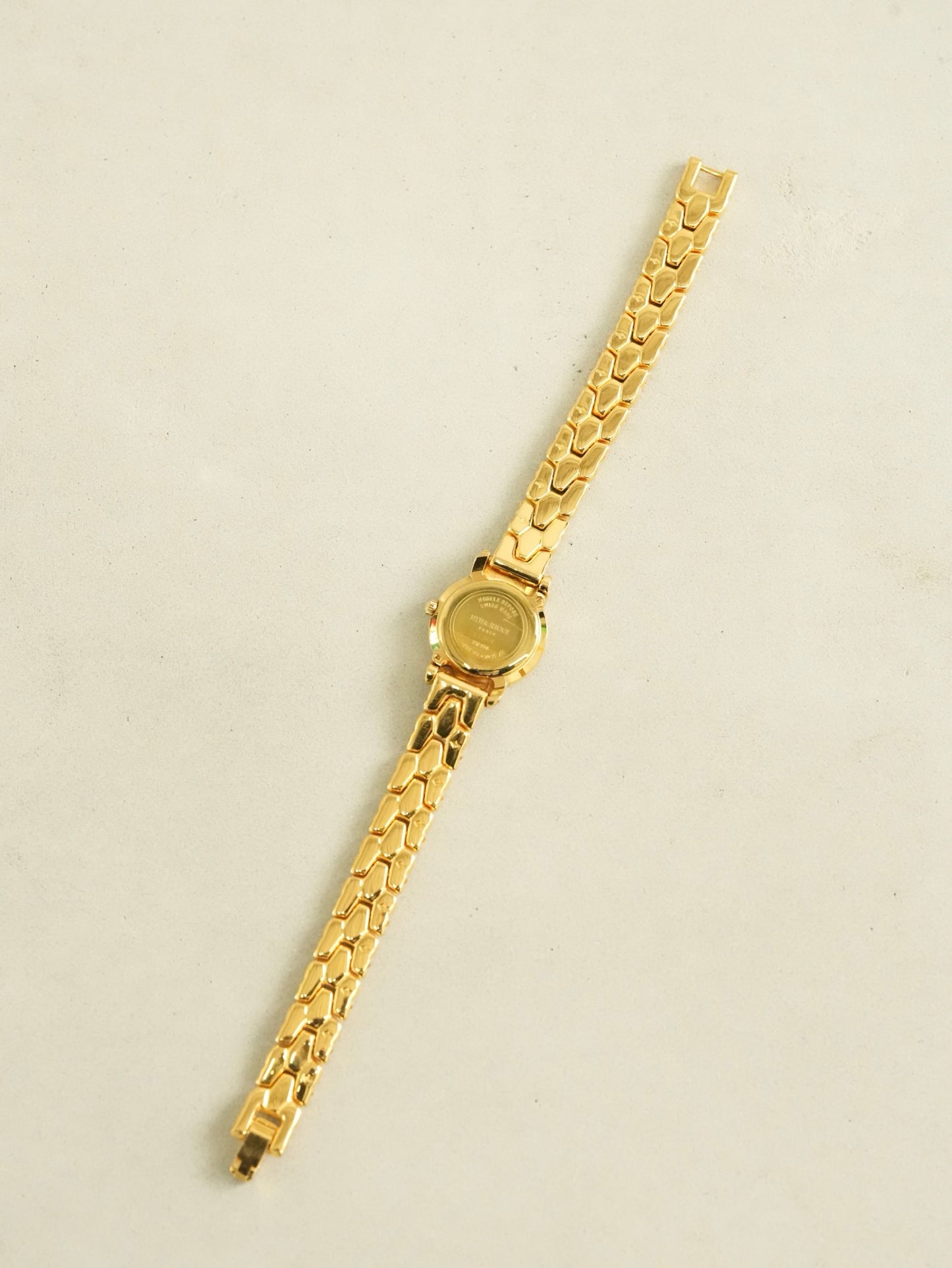 Nina Ricci Mother of Pearl Dial Two-Tone Bracelet Watch – Gold & Silver Belt Design
