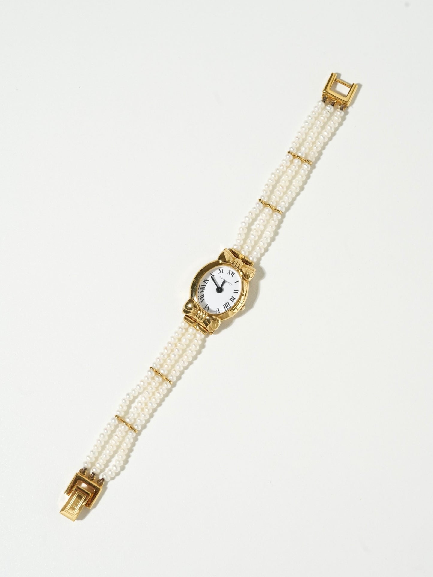 Nina Ricci Pearl Bracelet Watch Set – Gold Case, White Dial with Extra Leather Straps