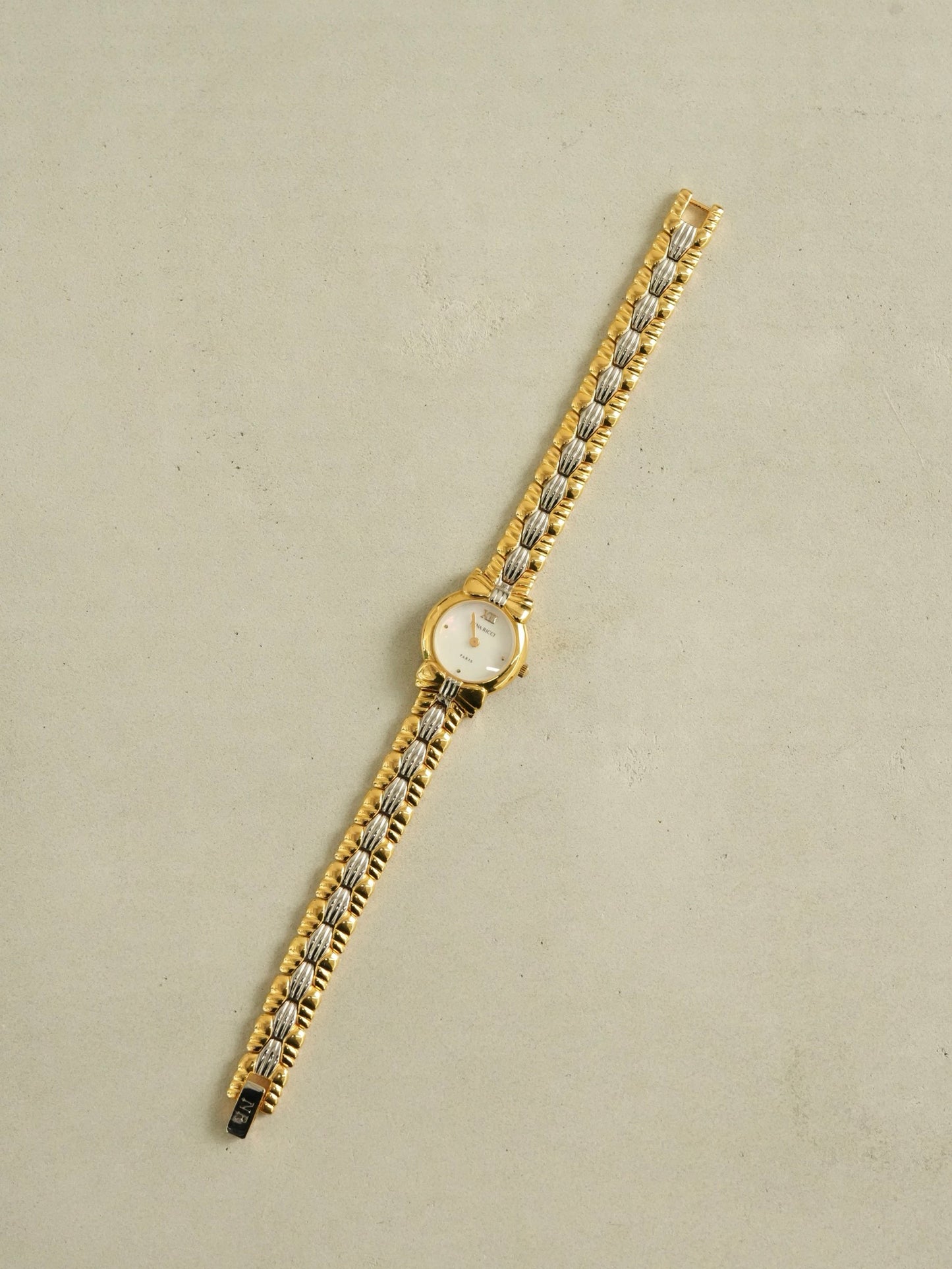 Nina Ricci Mother of Pearl Dial Two-Tone Bracelet Watch – Gold & Silver Belt Design