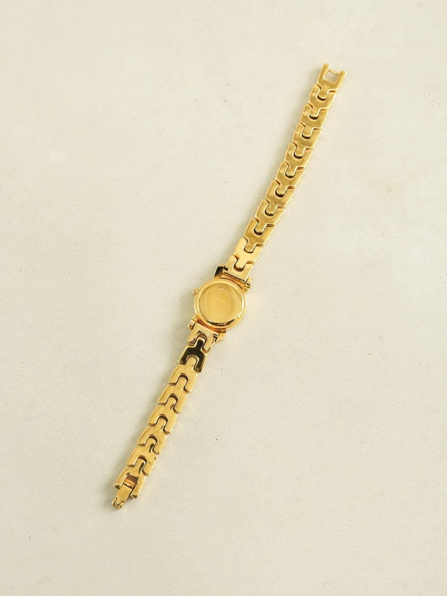Nina Ricci Ribbon Motif Bracelet Watch – Gold Tone Mother of Pearl Dial – With Original Box & Extra Leather Straps Set
